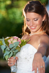 Poster - Happy woman, bride and bouquet of flowers at wedding for marriage, love or commitment at outdoor ceremony. Married female person smile with floral roses in beauty or dress for celebration in nature