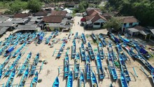 Aerial View Of Beautiful Traditonal Fisherman Village With Many Traditional Fishing Boat On The Beachside At Ngrenehan Beach, Gunungkidul, Yogyakarta In The Morning Sunny Weather. 4k Video Footage.