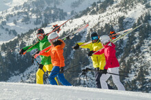 Group Of Skiers Carrying Equipment In Swiss Alps