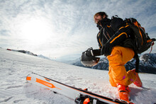 Skier In Bright Gear Enjoying The Swiss Alps