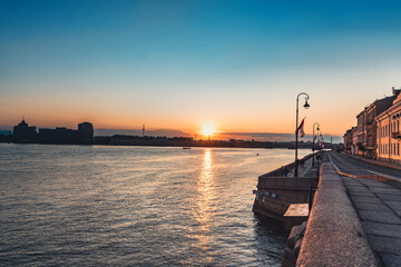 Wall Mural - Sunrise over Neva river on Palace embankment. Early morning in Saint-Petersburg. Russia