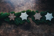 Christmas gingerbread on a wooden background with pine