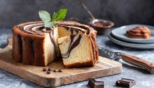 Classic marble cake on a cutting board. Moist and fluffy, with a delicious chocolate swirl 