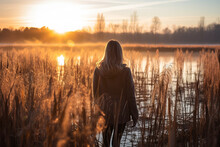 Fresh And Pure Human With Stunning Splendor Of A Wetland At Dawn, As First Rays Of Sunlight Emerge Over Horizon, Casting Shadows On Tall Grasses And Symbolizing Beginning Of A Fresh Day