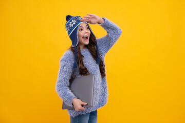 Sticker - Autumn school. Teenager school girl in autumn clothes hold laptop on yellow isolated studio background. Happy face, positive and smiling emotions of teenager girl.