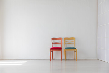 Poster - Two vintage chairs in the interior of a white room