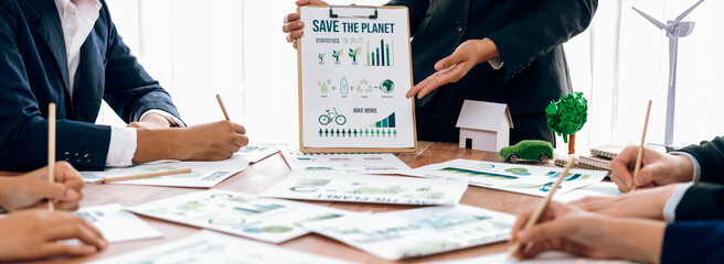 Wall Mural - Eco business company meeting with group of business people planning strategy and discuss marketing of eco-friendly and renewable clean energy products. Green business company concept. Trailblazing