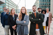 © Jose Calsina - Big group of executive businesspeople posing for a portrait looking at camera at workplace with successful attitude. Finance coworkers staring front. Meeting of business people. Corporate partnership