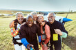 © Marko Geber - Group of joyful seniors take a selfie after their skydiving adventure