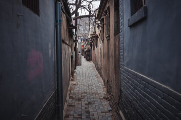 Canvas Print - Narrow alley in hutong area in Beijing city, China