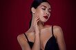 Photo of lovely asian young girl femme fatale closed eyes touch neck shoulders off isolated dark red color background