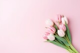 Fototapeta Tulipany - Beautiful composition spring flowers. Bouquet of pink tulips flowers pastel pink background. Valentine's Day, Easter, Birthday, Happy Women's Day, Mother's Day. Flat lay, top view, copy space