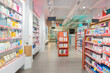 © ADDICTIVE STOCK - Assorted drugs arranged on shelves in store