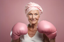 Generative AI illustration of happy senior woman with head wrap in pink boxing gloves representing fight against cancer on pink background