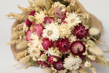 Canvas Print - Beautiful bouquet of dry flowers on white background, closeup