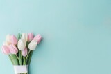 Beautiful composition spring flowers. Bouquet of pink white tulips flowers pastel blue background. Valentine's Day, Easter, Birthday, Happy Women's Day, Mother's Day. Flat lay, top view, copy space