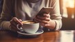 © Faisal - Close up a woman having a cup of coffee while using phone