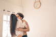 © Wongsakorn - Asian couple having passionate sex in the bedroom. Romantic couple in bedroom. She loves being adored by his beloved.
