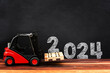 Happy new year 2024. Year 2024 with red forklift
