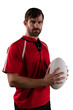 Digital png photo of serious caucasian rugby player holding ball on transparent background