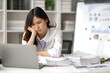 © Kainnika - Asian women who are serious about working in the office are stressed by working too hard and missing deadlines.