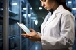 © Ankit - Female Scientist in Lab Coat Analyzing Data on Tablet Computer in High-Tech Data Center Environment Generative AI