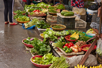 Canvas Print - Fresh vegetables on display in a traditional market	