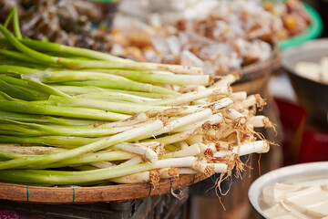 Wall Mural - Green onions at the traditional market