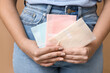 © Pixel-Shot - Beautiful young woman with menstrual pads on brown background, closeup