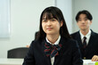 © Paylessimages - 教室で勉強している制服の高校生
