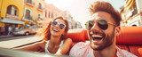 Fototapeta  - Happy young couple is enjoying ride in a cabriolet car during summer sunny day, active lifestyle concept