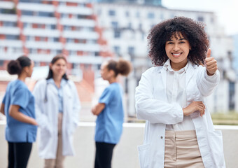 Wall Mural - Thumbs up, portrait and doctor or woman in healthcare support, thank you or excellence for hospital services. African person with like, yes or okay hand or emoji for outdoor clinic success on rooftop