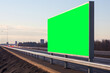 Urban Billboard with Green Screen on the City Overpass. Billboard with Chroma key. Billboard mockup