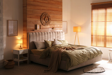 Wall Mural - Comfortable bed with new pistachio linens in modern room interior