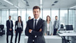 © Yuwarin - businessman in office with a team behind