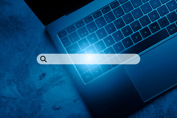 Laptop keyboard top view with VR search bar. SEO. Browser technology. Concept of searching on internet with copy space.