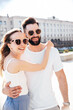 © halayalex - Smiling beautiful woman and her handsome boyfriend. Woman in casual summer clothes. Happy cheerful family. Female having fun. Couple posing in street at sunny day. Having tender moments. In sunglasses
