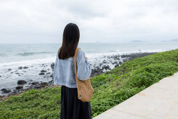 Poster - Woman look at the sea at bad fog weather