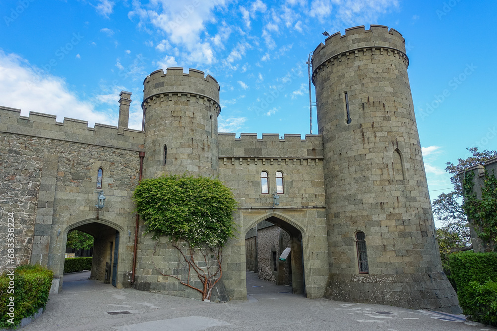 Vorontsov Palace in Crimea in summer. Ancient walls with many columns ...