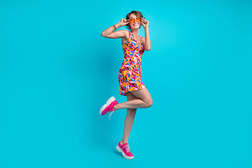 Canvas Print - Full length photo of carefree dreamy girl dressed print outfit hands arms dark eyewear looking empty space isolated blue color background