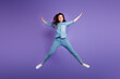 © deagreez - Full body portrait of overjoyed satisfied young lady jumping make star figure isolated on purple color background