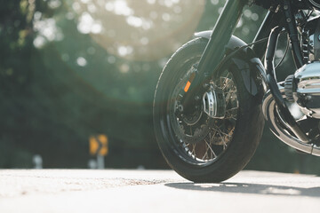 Wall Mural - motorcycle in a sunny motorbike on the road riding.with sunset light. copyspace for your individual text. classic motorcycle.	