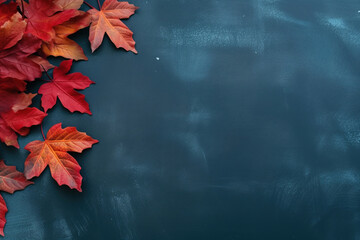 Wall Mural - Autumn background with colored red leaves on blue slate background. Top view, copy space for banner or poster
