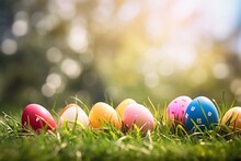 Colorful Easter Eggs In Grass. Happy Easter Background.