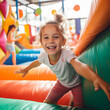 © Nomad_Soul - Happy girl child having fun at indoor park playground. Generative AI