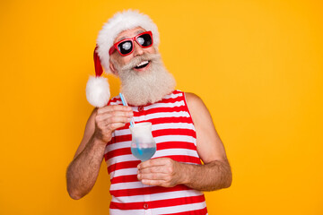 Sticker - Photo of good mood dreamy senior guy christmas swimwear sunglass drinking cocktail looking empty space isolated yellow color background