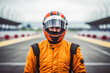 Portrait of formula one racing driver looking focus with safety helmet and uniform on before the start of competition or racing tournament