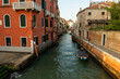 Little canal water on lagoon in venice italy with couleur palaces and boat