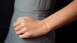 delicate golden bracelet on a model's wrist, closeup