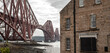 The Forth Bridge, view from North Queensferry town in Edinburgh neighborhood, Scotland industrial landscape